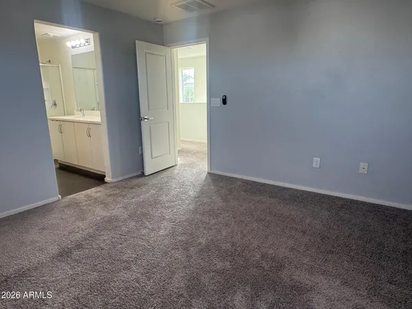 an empty room with closet area