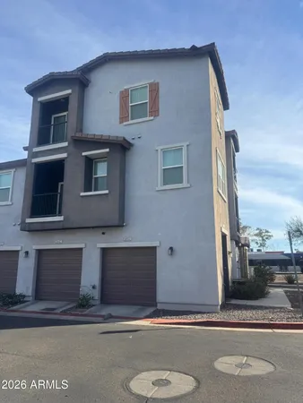 a front view of a house with garage