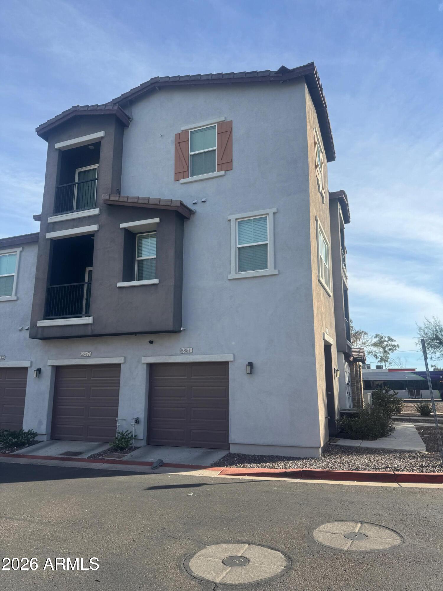 5851 South 23rd Way Phoenix, AZ 85040 - Photo 2 of 24 a front view of a house with garage