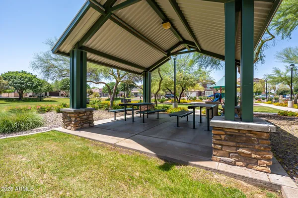 a swimming pool with outdoor seating and yard