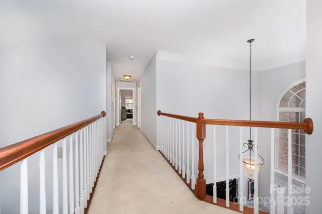 a view of a hallway with stairs