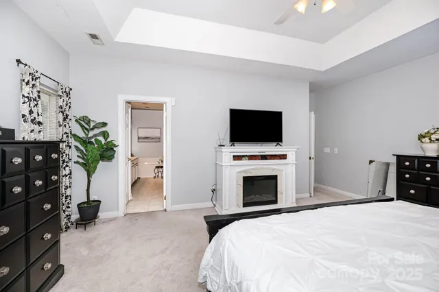 a bedroom with a bed and a television