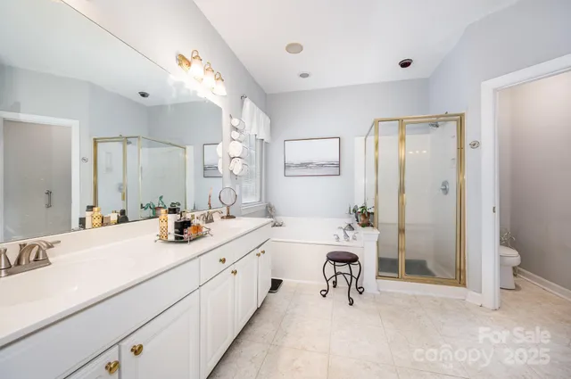 a bathroom with a sink double vanity and a mirror