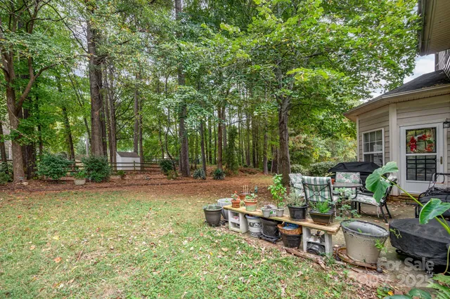 a view of a backyard with sitting area