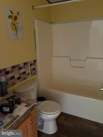 a bathroom with a toilet and a sink