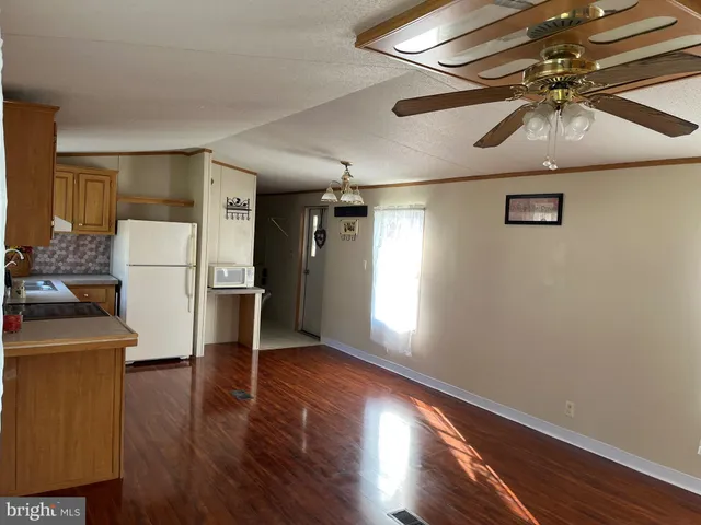 a view of a livingroom with wooden floor