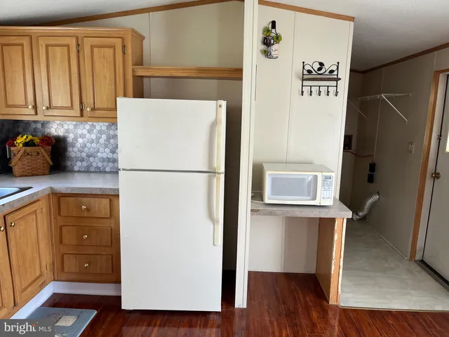 a kitchen with stainless steel appliances a refrigerator and a stove