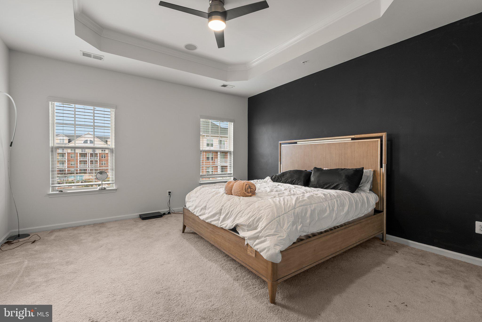 14407 Sandy Ridge Lane Laurel, MD 20707 - Photo 17 of 29 a bed sitting in a spacious bedroom next to a window