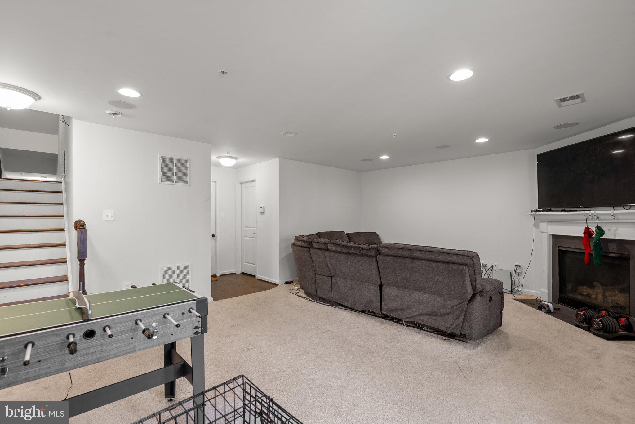 14407 Sandy Ridge Lane Laurel, MD 20707 - Photo 23 of 29 a living room with furniture and a flat screen tv