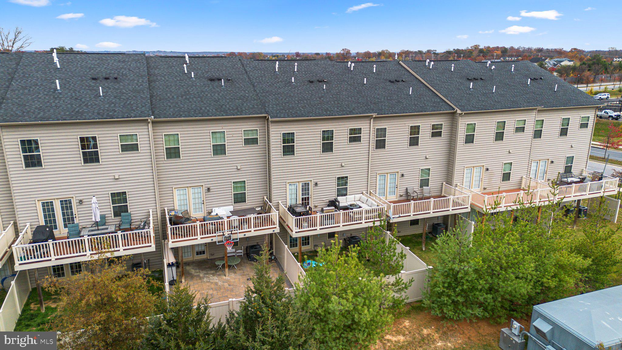14407 Sandy Ridge Lane Laurel, MD 20707 - Photo 27 of 29 an aerial view of a house with swimming pool and a yard