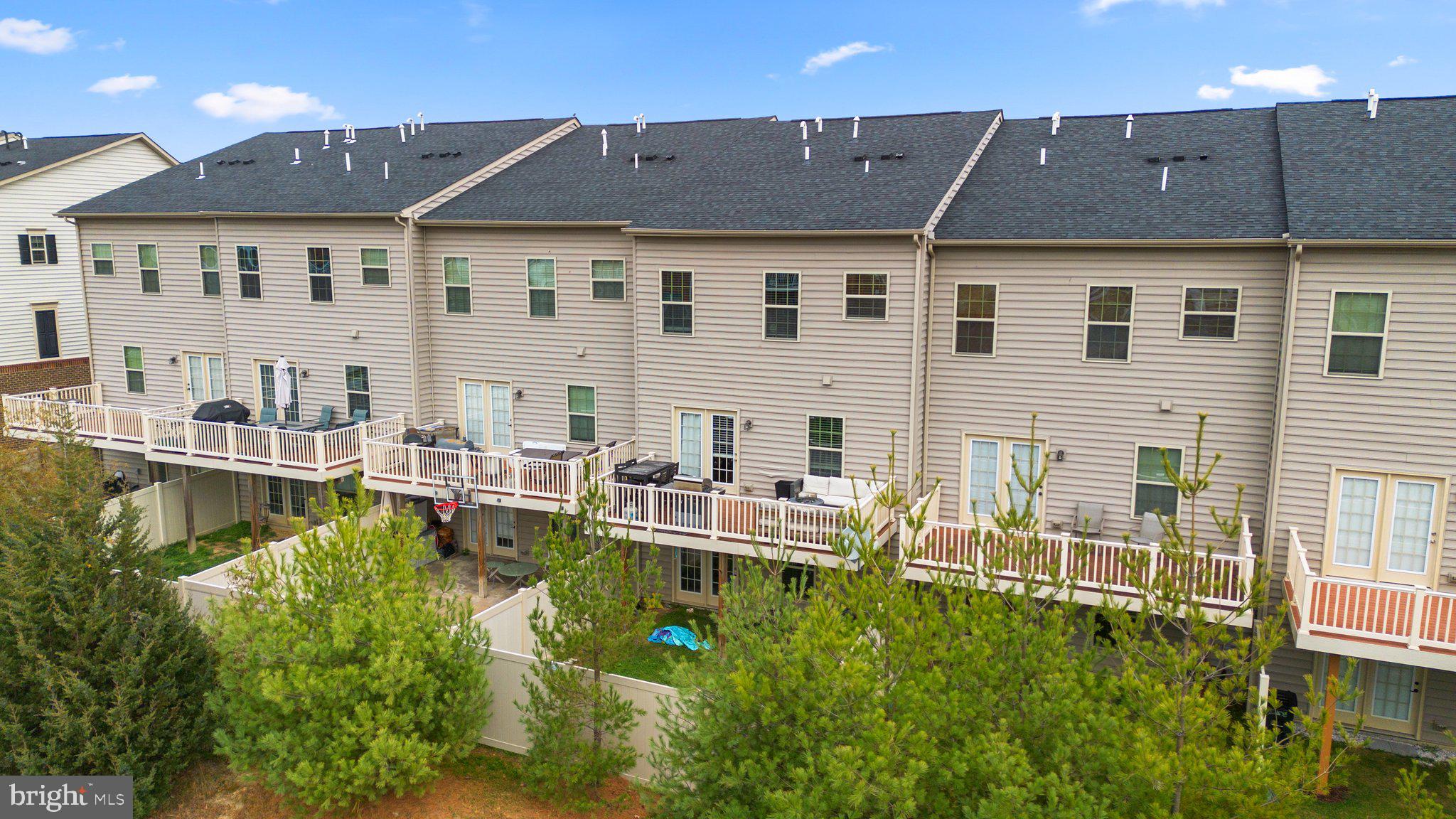 14407 Sandy Ridge Lane Laurel, MD 20707 - Photo 29 of 29 a view of a house with pool and chairs