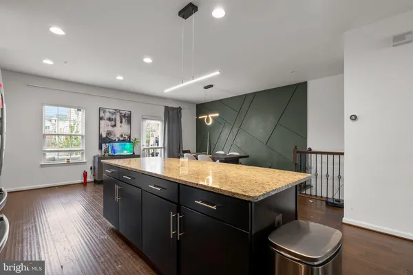 a room with a table chairs and wooden floor