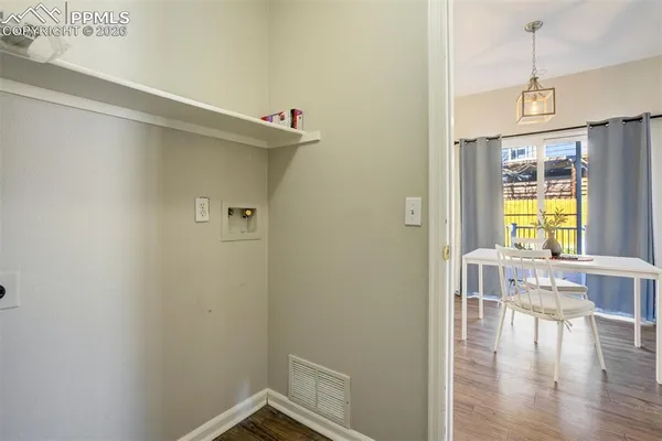a view of livingroom with furniture and wooden floor
