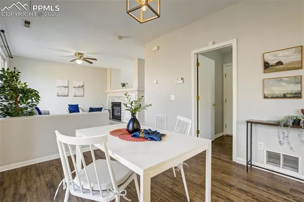 a view of a dining room with furniture and wooden floor