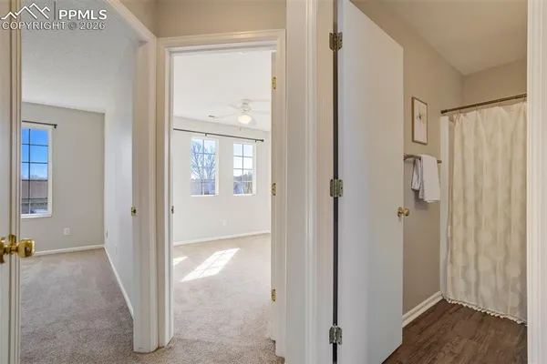 a view of a bathroom with a glass door and shower