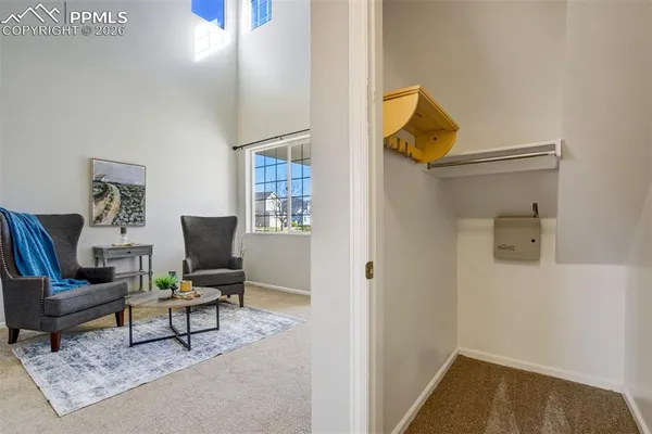 a living room with furniture and a rug