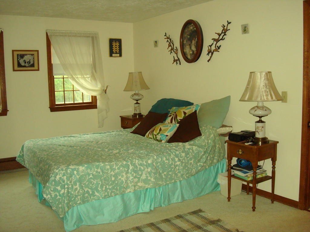 31 Stuart Road Rochester, MA 02770 - Photo 18 of 30 a bedroom with a bed and dresser