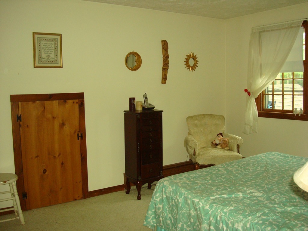 31 Stuart Road Rochester, MA 02770 - Photo 19 of 30 a bedroom with a bed and a window