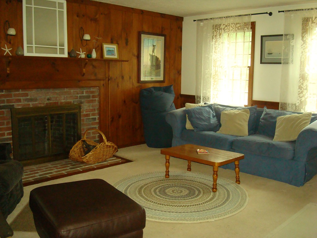 31 Stuart Road Rochester, MA 02770 - Photo 3 of 30 a living room with furniture and a fireplace