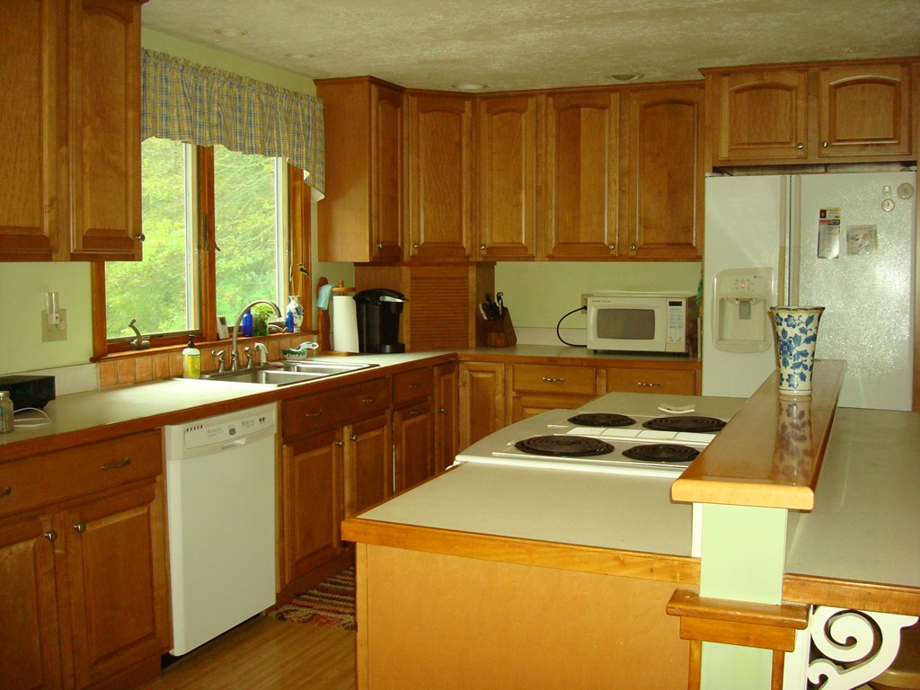 31 Stuart Road Rochester, MA 02770 - Photo 5 of 30 a kitchen with a sink and a stove top oven