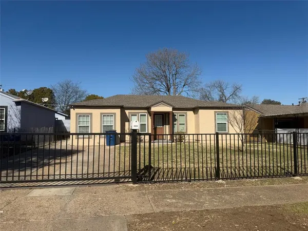 a view of a brick house with a large window