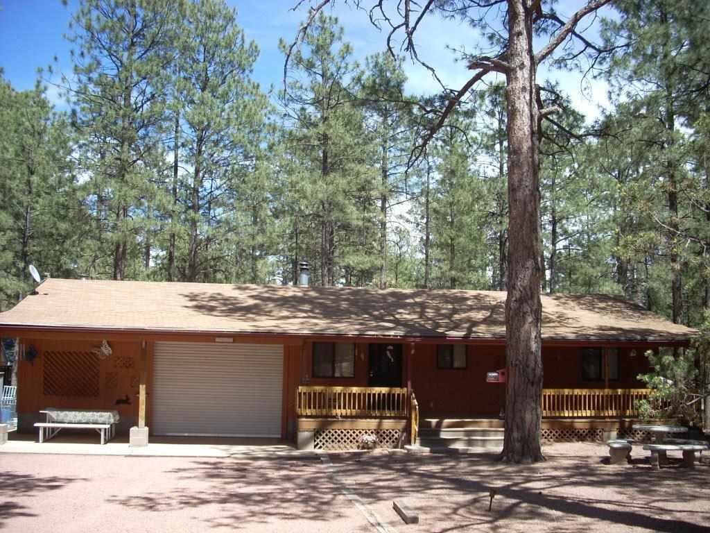 2923 Markham Road Overgaard, AZ 85933 - Photo 1 of 33 a view of a house with a yard and sitting space
