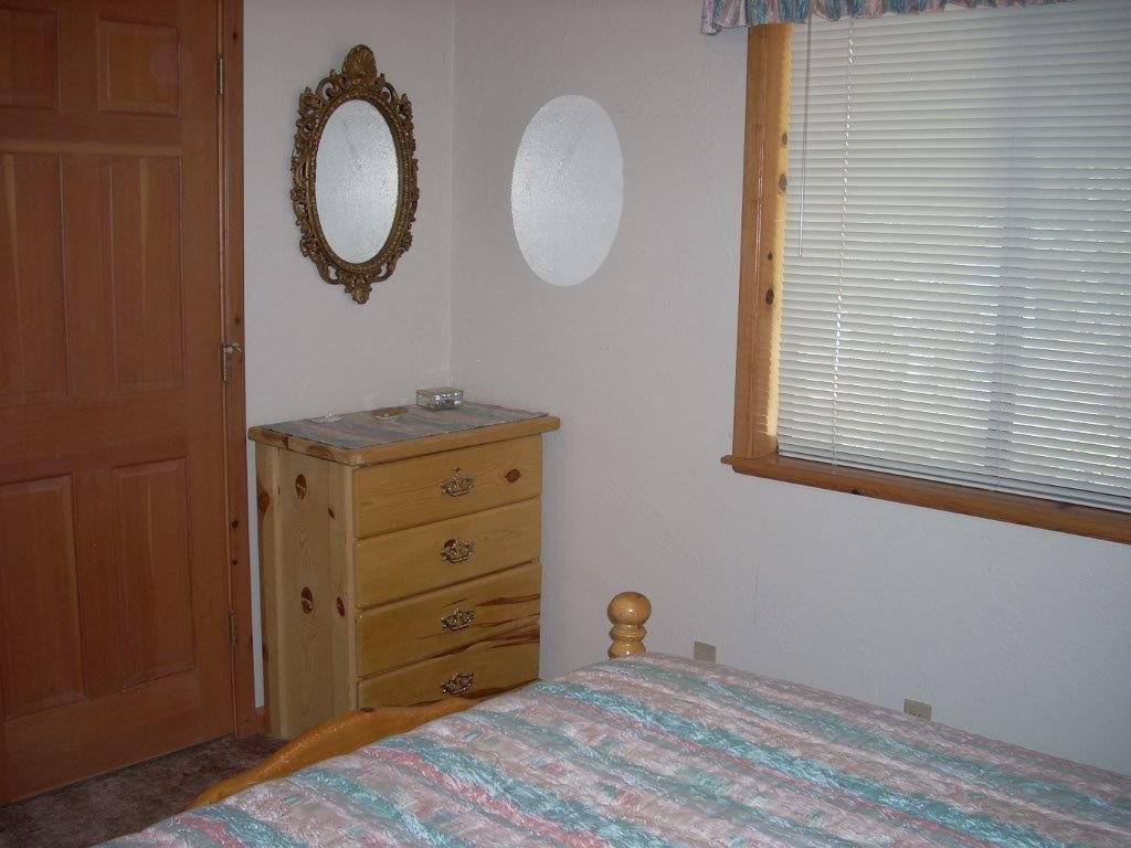 2923 Markham Road Overgaard, AZ 85933 - Photo 13 of 33 a view of a room with wooden floor and windows