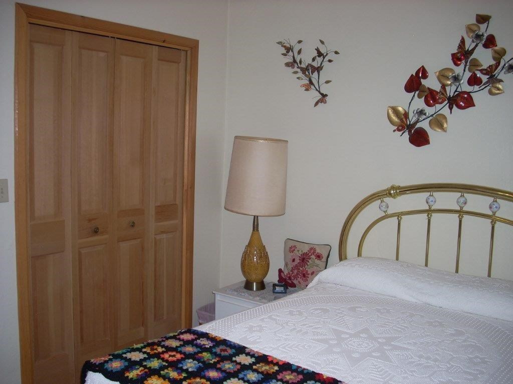2923 Markham Road Overgaard, AZ 85933 - Photo 14 of 33 a bedroom with a bed and a window