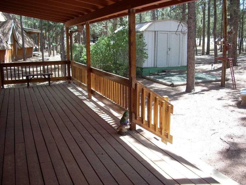 2923 Markham Road Overgaard, AZ 85933 - Photo 2 of 33 a view of a wooden deck