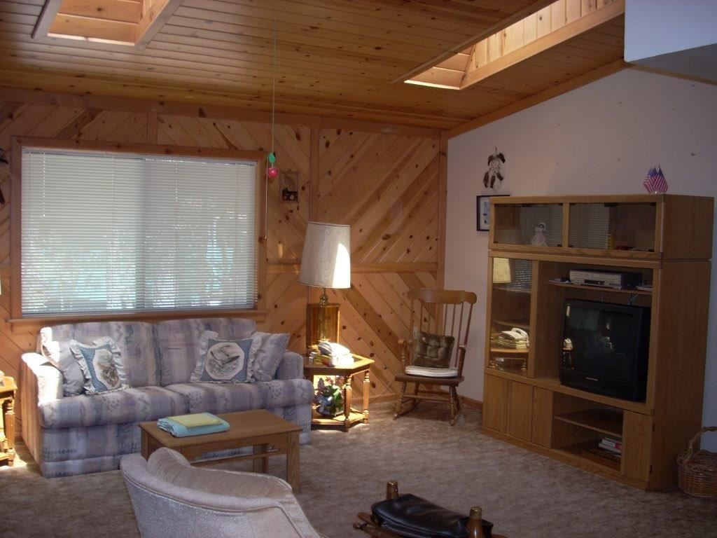 2923 Markham Road Overgaard, AZ 85933 - Photo 6 of 33 a living room with furniture and a fireplace
