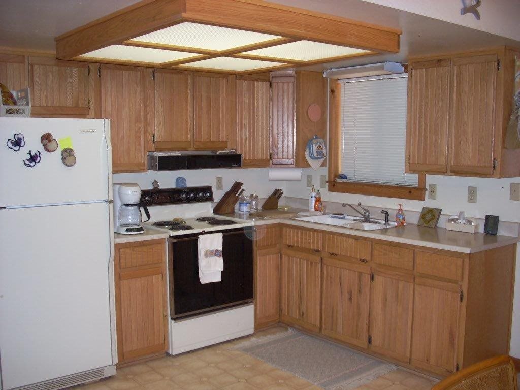2923 Markham Road Overgaard, AZ 85933 - Photo 8 of 33 a kitchen with stainless steel appliances granite countertop a stove a sink and a refrigerator