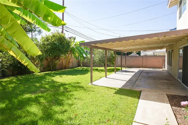 a view of a backyard with sitting area