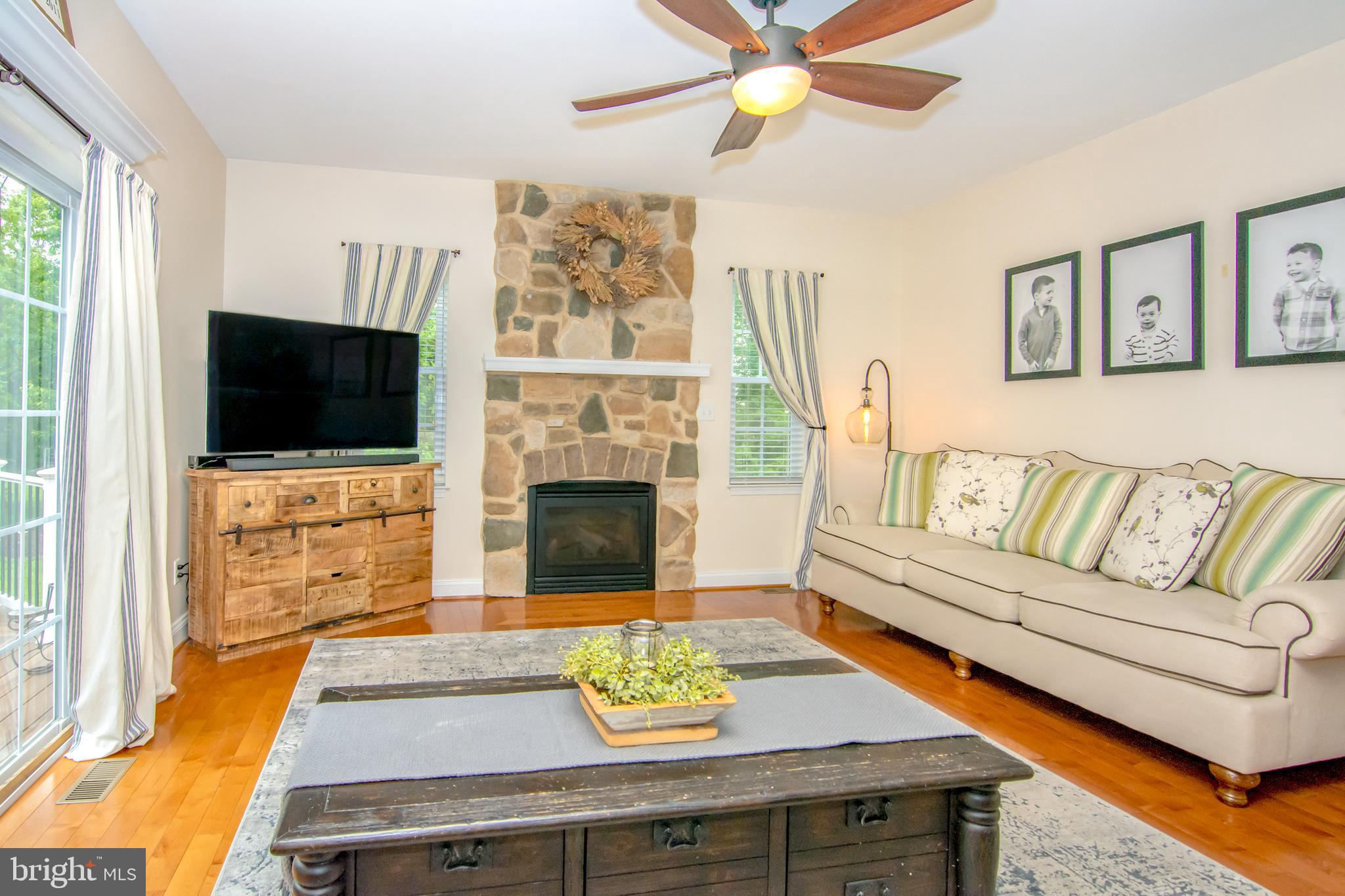 167 Aubel Road Delta, PA 17314 - Photo 11 of 27 Family Room with a Stone Hearth Fireplace