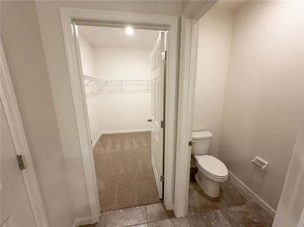 a bathroom with a glass shower door