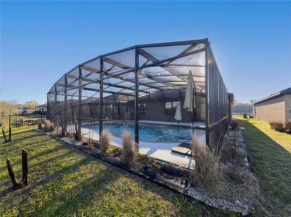 a view of a house with a yard from a balcony