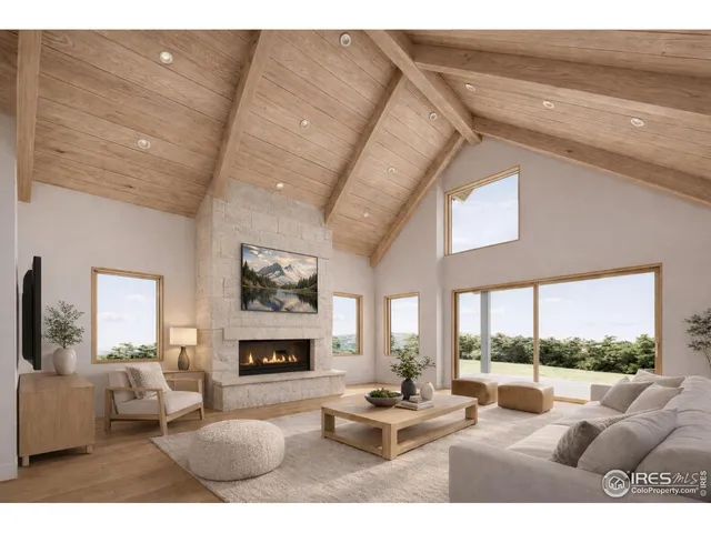 a living room with furniture fireplace and a large window