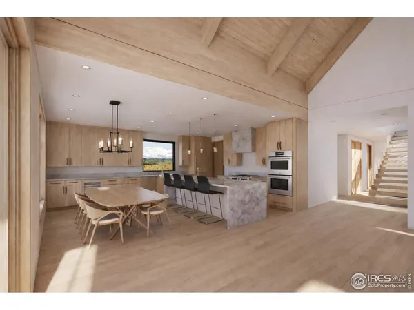 a living room with furniture a window and kitchen view