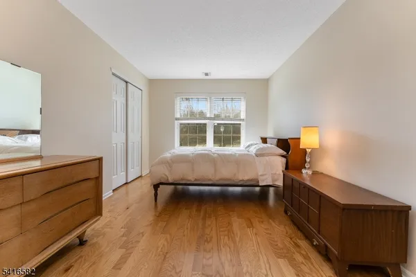 a bed room with a bed and a window