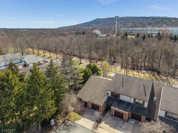 an aerial view of a house with mountain view