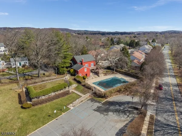 a view of a house with a yard and mountain view