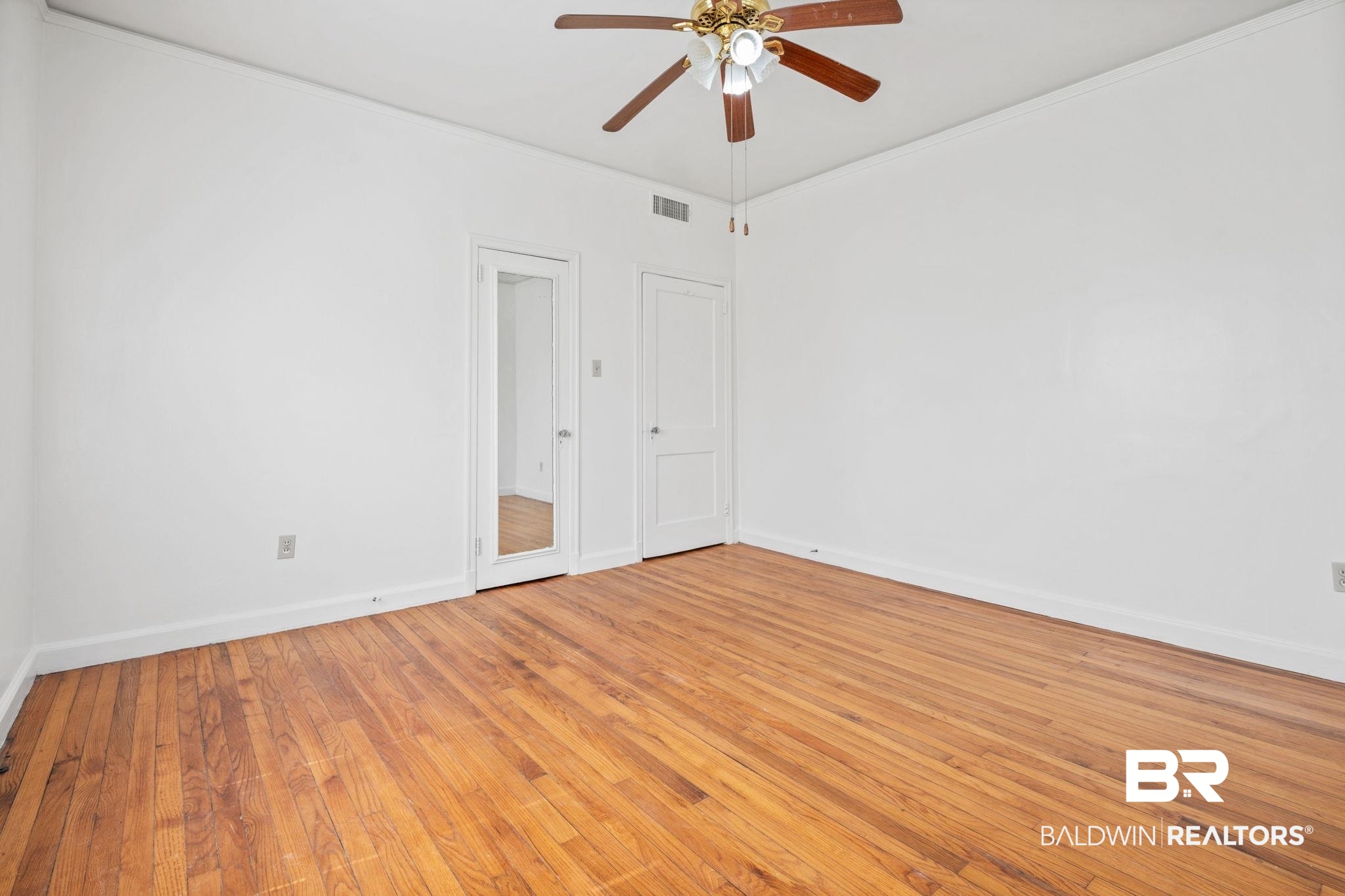 1707 Church Street Mobile, AL 36604 - Photo 14 of 43 Unfurnished room featuring visible vents, baseboards, and light wood-style flooring