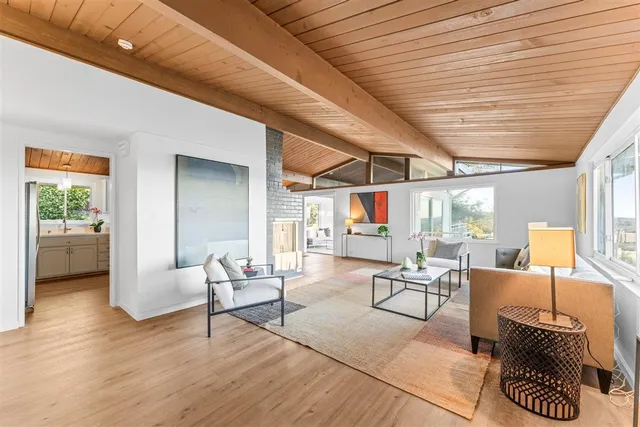 a dining room with furniture and a window