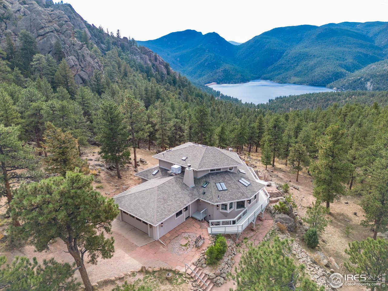 an aerial view of a house with an outdoor space
