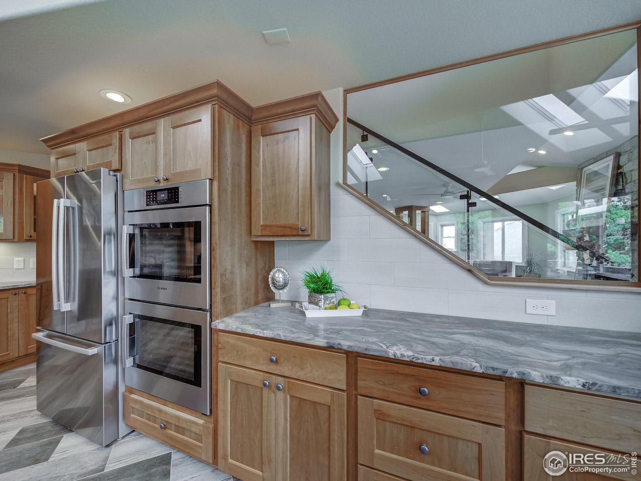5634 Longmont Dam Road Lyons, CO 80540 - Photo 13 of 34 a kitchen with stainless steel appliances granite countertop a refrigerator and a sink