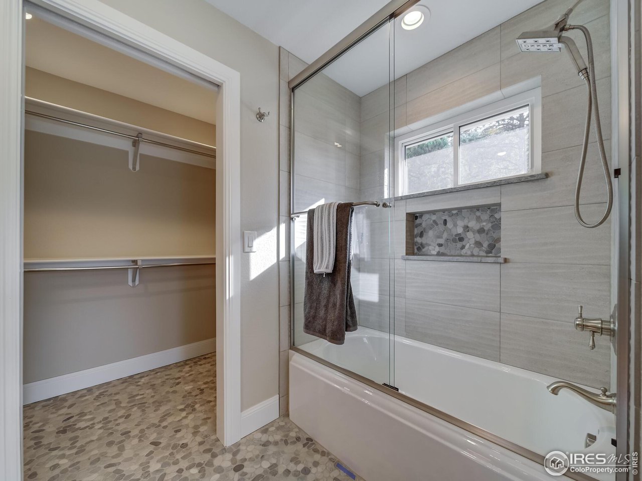 5634 Longmont Dam Road Lyons, CO 80540 - Photo 20 of 34 a bathroom with a bathtub and a shower
