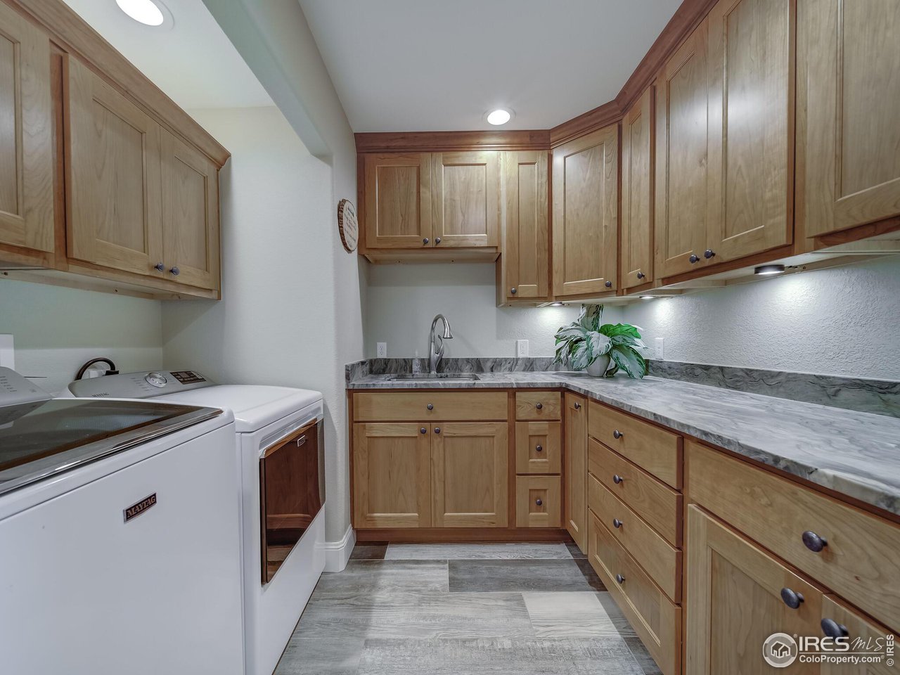 5634 Longmont Dam Road Lyons, CO 80540 - Photo 24 of 34 a kitchen with granite countertop cabinets stainless steel appliances and a sink