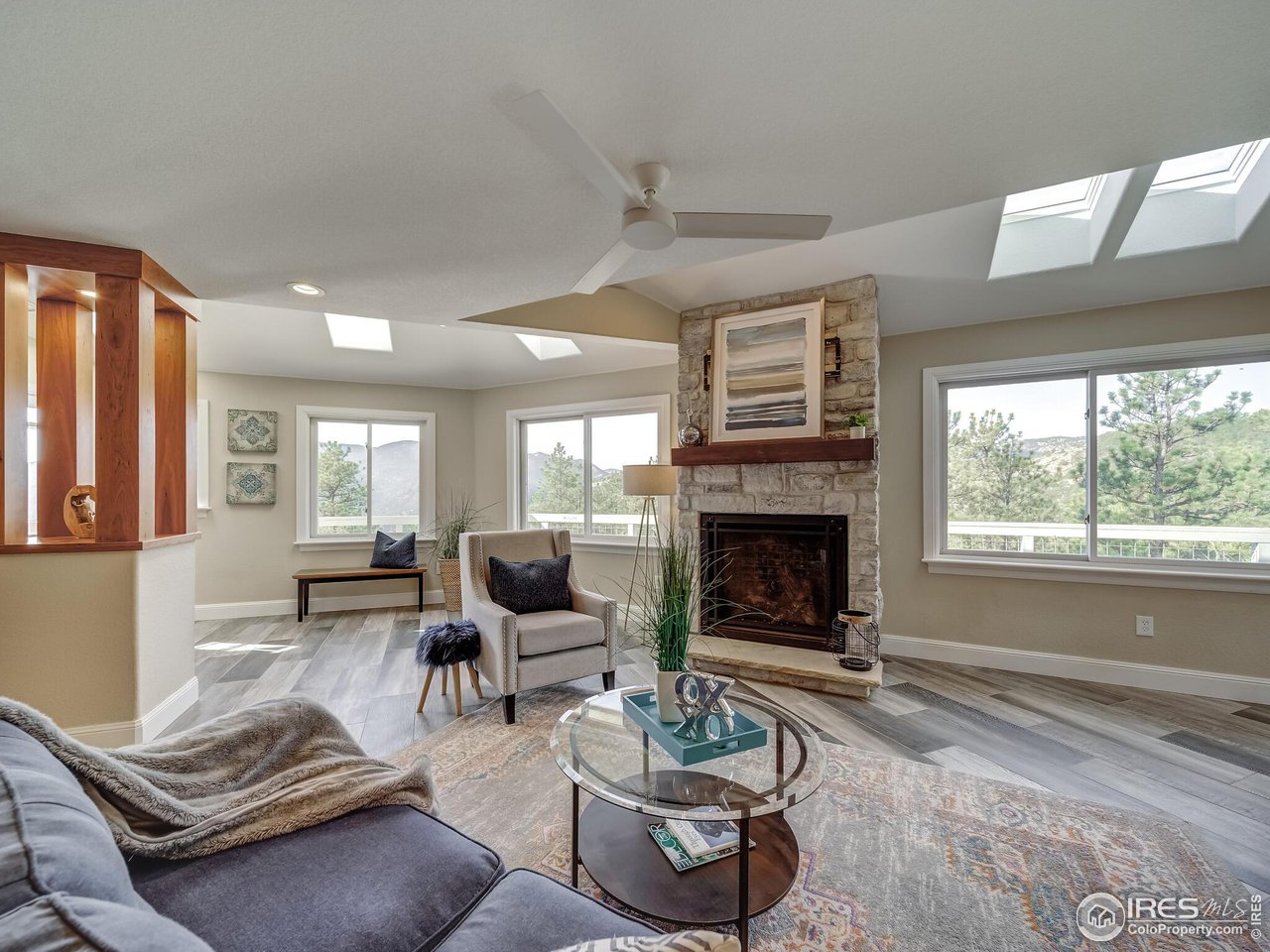 5634 Longmont Dam Road Lyons, CO 80540 - Photo 4 of 34 a living room with furniture fireplace and window