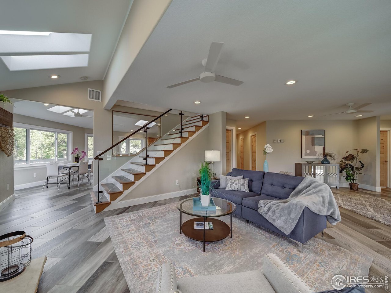 5634 Longmont Dam Road Lyons, CO 80540 - Photo 6 of 34 a living room with furniture and wooden floor