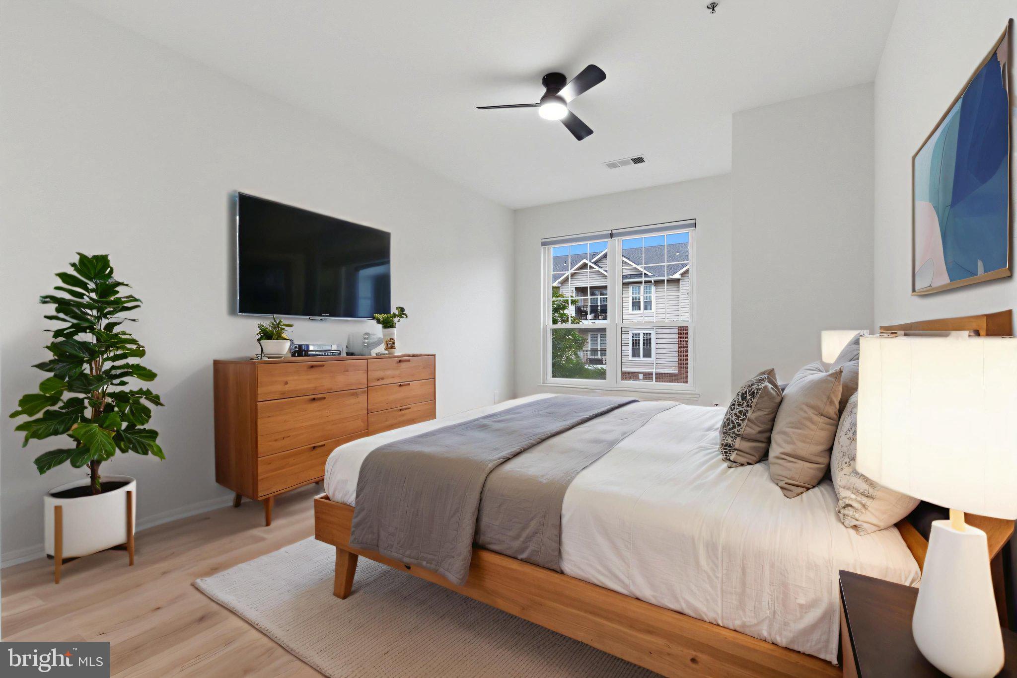 1580 Spring Gate Dr., Unit 4303 McLean, VA 22102 - Photo 4 of 41 Modern serenity in a cozy bedroom.