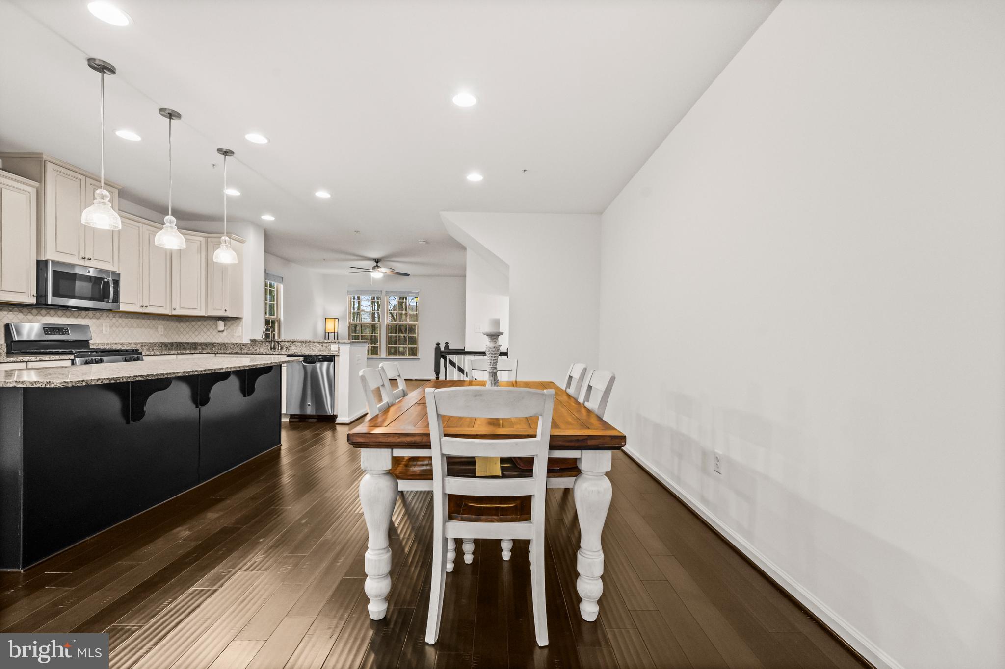 7839 Patterson Way Hanover, MD 21076 - Photo 14 of 56 a kitchen with stainless steel appliances kitchen island granite countertop a sink and cabinets